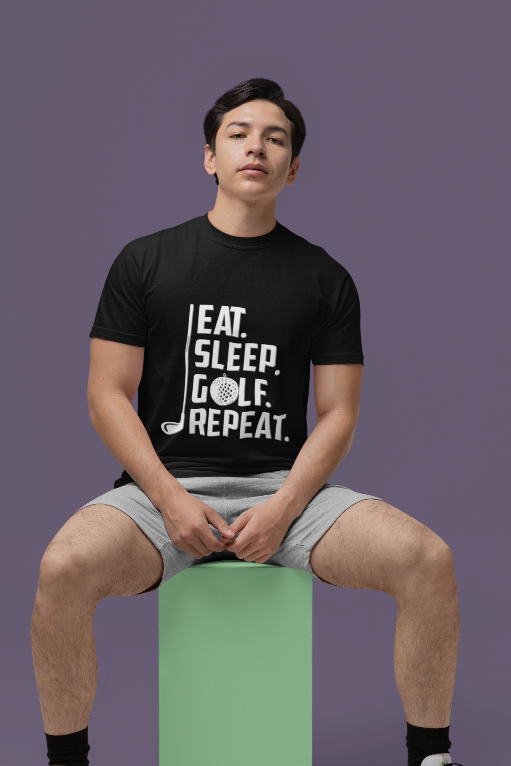 comfort-colors-t-shirt-mockup-featuring-a-serious-man-sitting-a-colorful-cube-m53017.png