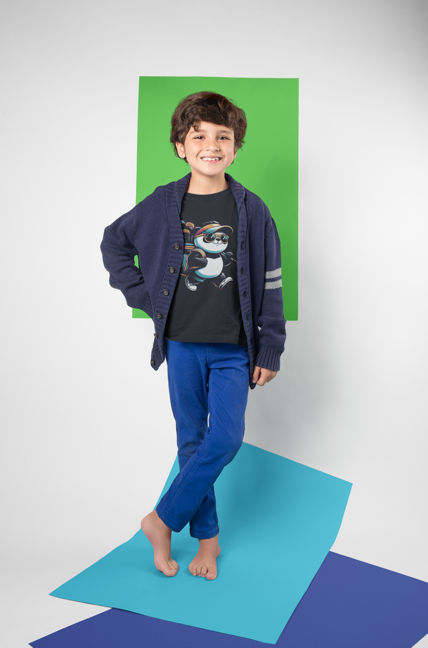 mockup-of-a-little-kid-posing-wearing-a-t-shirt-in-a-photo-studio-with-color-papers-a19485.png