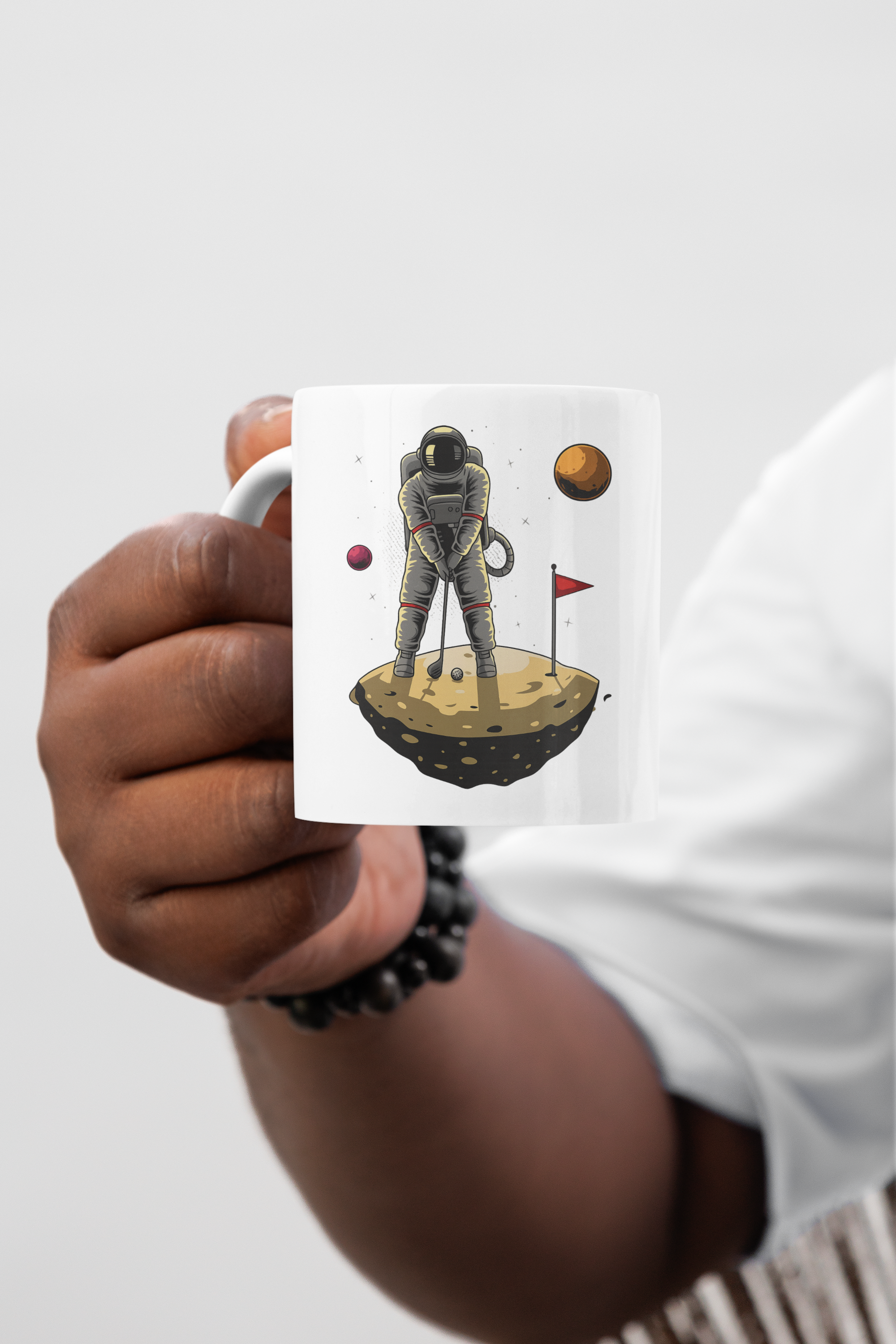 mockup-of-a-man-s-hand-holding-a-sublimated-11-oz-coffee-mug-m56916.png
