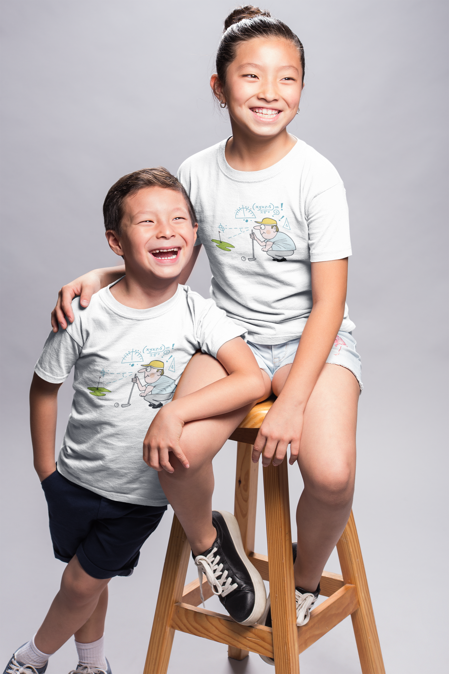 mockup-of-smiling-kids-wearing-t-shirts-in-a-photo-studio-a20950.png