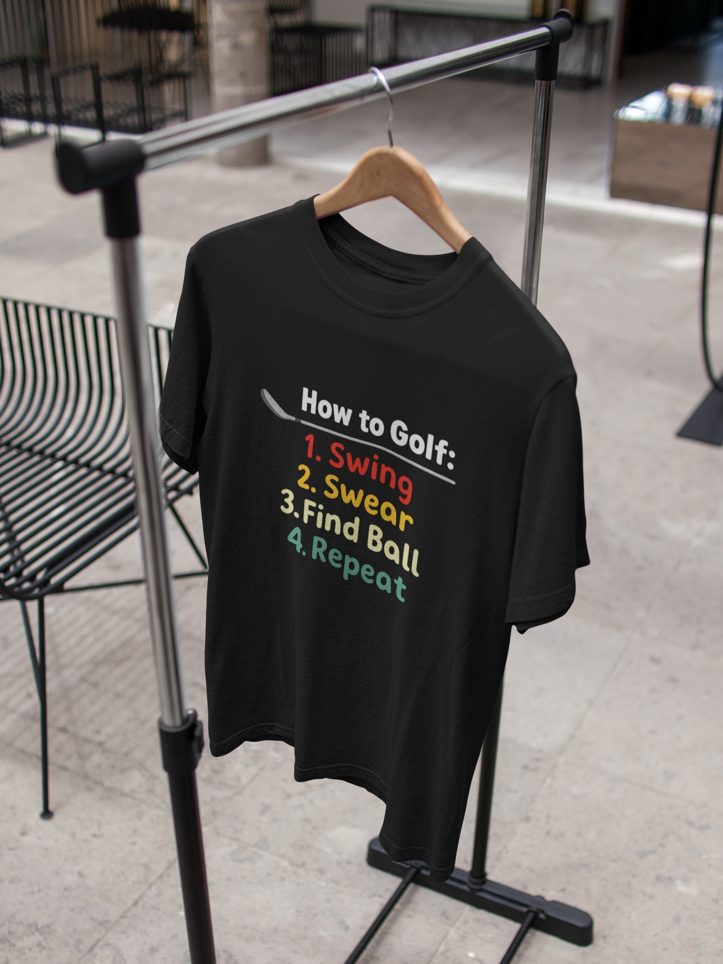 single-t-shirt-mockup-on-a-hanger-while-indoors-a16947.png