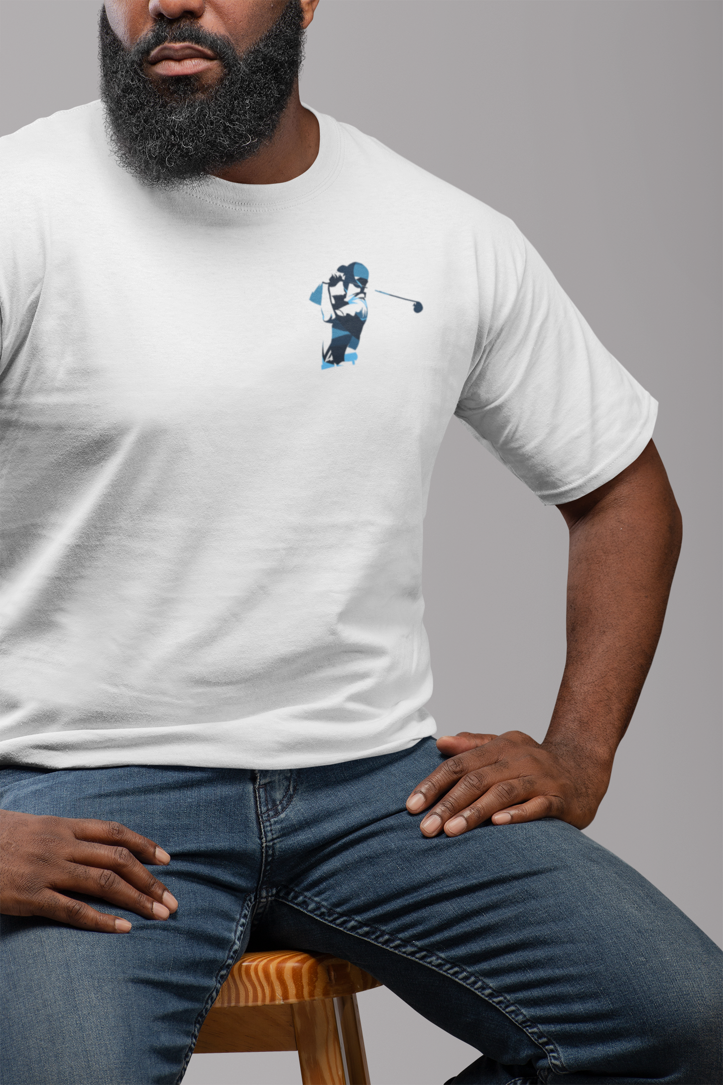 t-shirt-mockup-featuring-a-man-with-a-beard-sitting-on-a-chair-21529_a5cf413b-466f-407c-9e67-064defec55f2.png